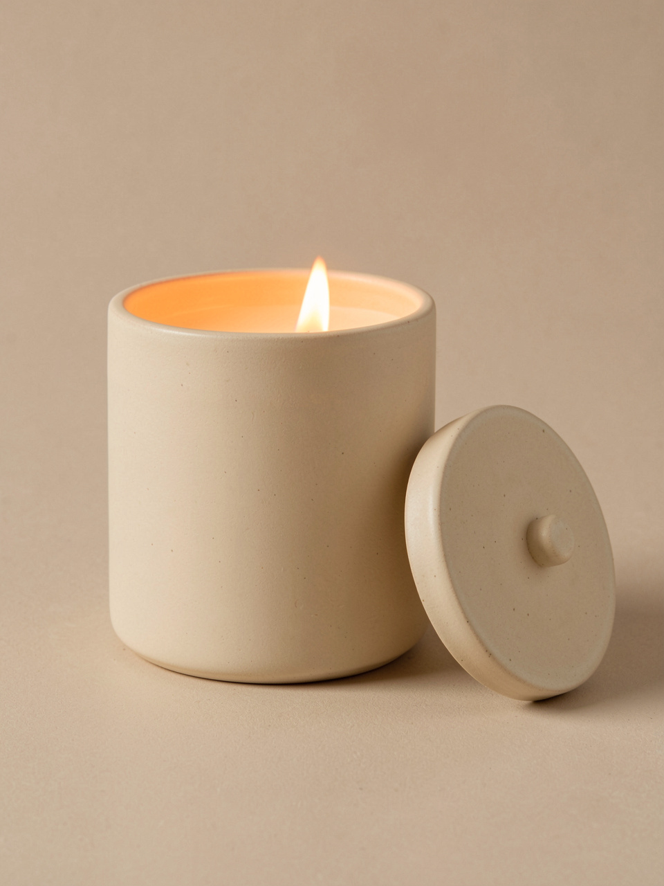 Ceramic jar candle lit